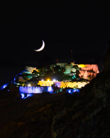 beautiful views of the city, beach and castle in the night, Spainの写真素材