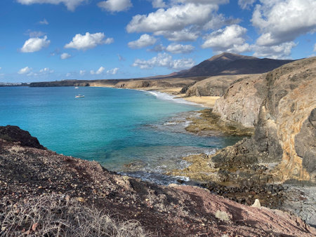 beautiful beach with turquoise water on cloudy day in spainの写真素材