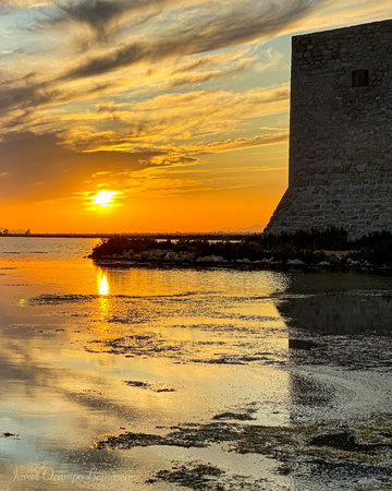 sunset on the salt lake on a day with cloudsの写真素材
