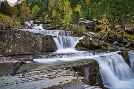 waterfall on large rocksの写真素材