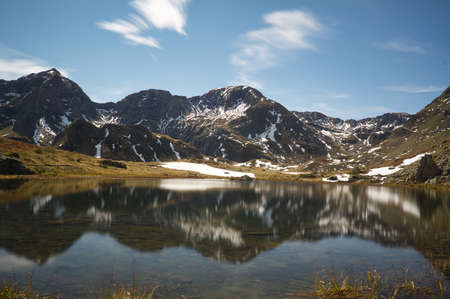 Ibon de Anayet and the Portalet with the bottom the Anayet peak. Concept famous mountains of the Aragonese Pyrenees, in Spainの写真素材