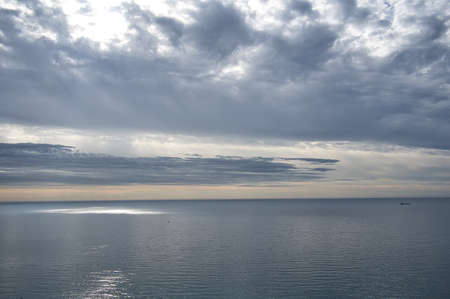 beautiful sunrise on the beach with rocks and clouds, located in Alicante, Spain. Viewの写真素材