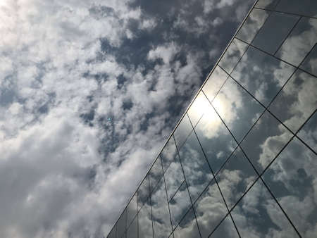 clouds reflected in glass building. Viewの写真素材
