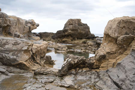 beach with rocks on the coast of the town of Morarira in the province of Alicante, Valencian community, Spain. viewの写真素材