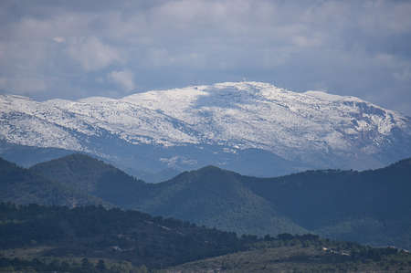 mountain views with the snowy summit in the town of Alicante, Spain, landscapeの写真素材