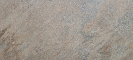 A close-up view of a textured surface with a mix of brown and gray colors