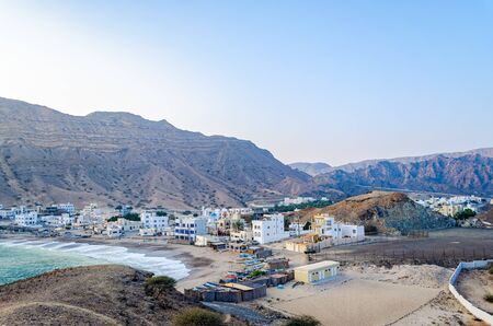 A small fishing village on the beach at the foot of the hills. From Muscat, Oman.の写真素材