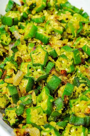 Closeup of Okra Stir Fry with grated coconut and mustard in a dishの写真素材