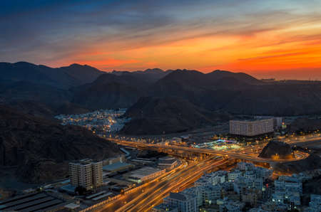 Beautiful Orange sky over Muscat city in the evening. Shot from a hilltop.の写真素材