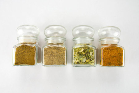 Spices in glassed boxes wigh caraway, dried leekの写真素材