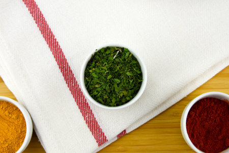 Top view of three kind of spices with kitchen towelの写真素材