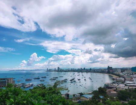 Beach town sky and plumeria treesの写真素材