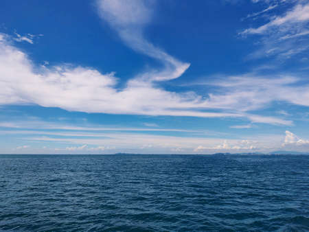 Blue sea with sky and cloudsの写真素材