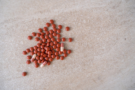 Piles of pills on the floorの写真素材