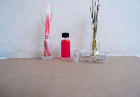 Dry twigs and essential oil bottlesの写真素材