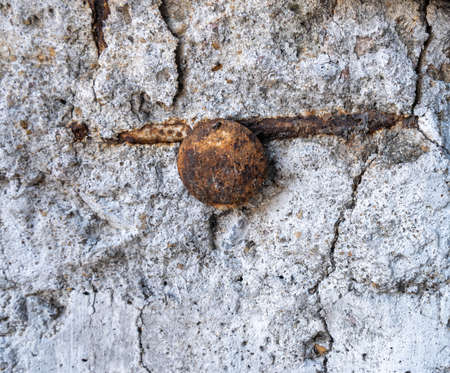 Old iron bolts That was buried in the cement for a long time until it was rusted and corroded until decay.の写真素材