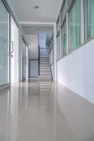 The corridor inside building, end of path is a staircase, to go up to the top.