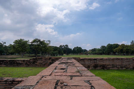 Ayutthaya old city, with brick road and behind the sky, is a tourist attraction.の写真素材