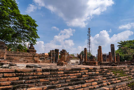Ayutthaya old city ruins, with signal towers and sky, behindの写真素材