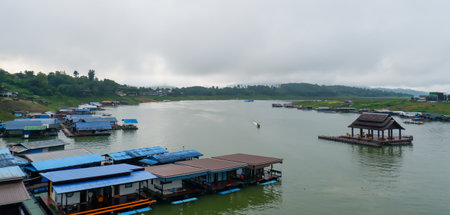 View from the second longest wooden bridge in the world, mist over the mountains.の写真素材