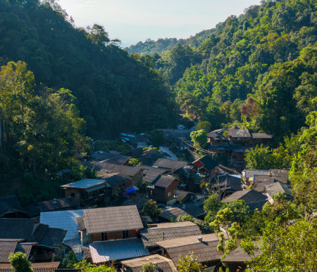 Mae Kampong village scenery overlooking house roofs and surrounding mountains, Chiang Mai, Thailandの写真素材