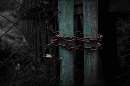 Old door lock Path to Darknessの写真素材