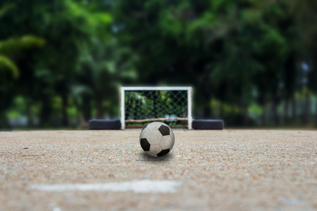 Soccer ball on ground, Street soccer ball in the countrysideの写真素材