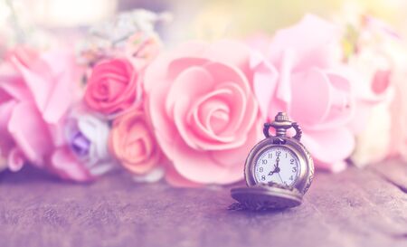 Vintage pocket watch with rose bouquet pastelの写真素材
