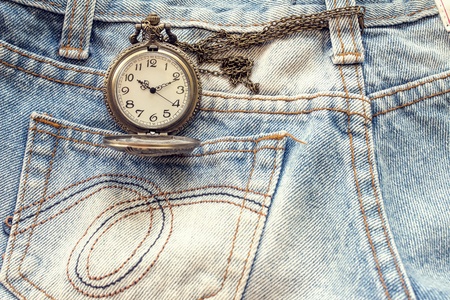 pocket watch in pocket of jeansの写真素材
