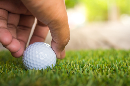Close-up hand hold golf ballの写真素材