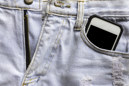 jeans and mobile phone. Phone in your pocket jeansの写真素材