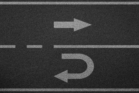 go straight and turn back asphalt road texture backgroundの写真素材