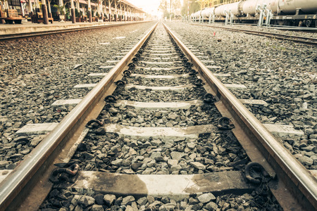 Old railroad tracks at train stationの写真素材