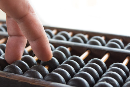 Hand and ABACUS old antique calculator retro finance education ,tool work business accountingの写真素材