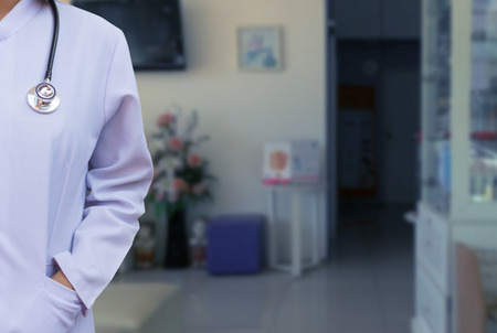 Medical doctor woman or physician in white gown uniform with stethoscope in hospital or clinicの写真素材
