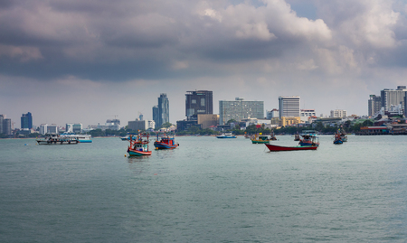 Fishing boat in Pattaya, Thailand during rainy seasonの写真素材