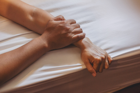 Soft focus a hairy man's hand holding a woman hand for rape and sexual abuse conceptの写真素材
