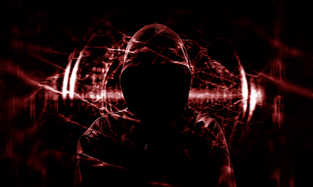 Silhouette of a hacker on black with binary codes