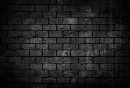 Crack brick wall black backgroundの写真素材