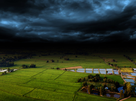 wide angle of agriculture farm and hill from high view shooting and storm cloudのeditorial素材