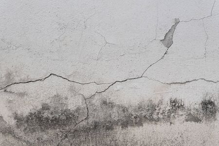 Old cracked stone wall texture background
