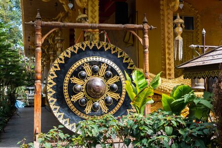 A large gong in a Buddhist temple in Thailandの写真素材