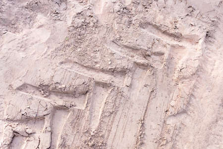 Tractor tracks on the sand top view