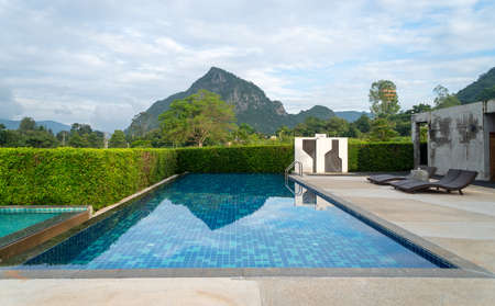 The swimming pool has a mountain view