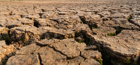 Dry water crisis deep cracks land symbolize hot weather and drought.の写真素材