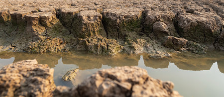Dry water crisis the land cracked near dry water.の写真素材