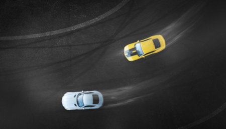 Aerial top view two cars drifting battle on race track, Two race cars view from above.