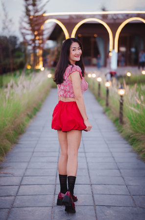 Asian woman in cute Japanese style red dress.の写真素材