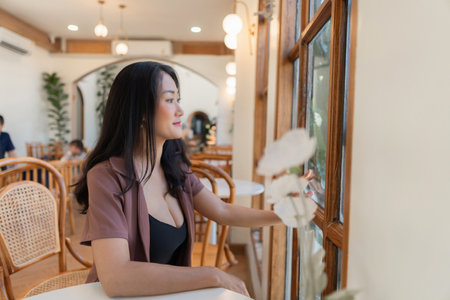 Portrait of asian woman in a cafe, coffee shop