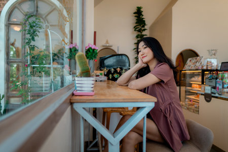 Portrait of asian woman in a cafe, coffee shop